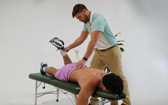 Chiropractor Sarasota FL Sebastian Torres Adjusting Patient